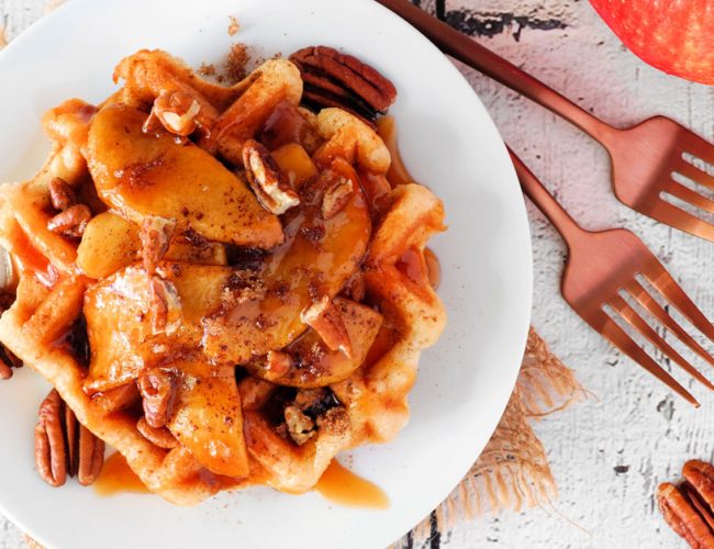 waffles topped with apples and caramel sauce